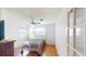 Serene bedroom with light hardwood floors, a comfortable bed, ample natural light, and classic decor at 671 Roanoke Rd, Venice, FL 34293