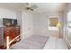 Cozy bedroom featuring a bed, dresser, and window, creating a comfortable and inviting space at 671 Roanoke Rd, Venice, FL 34293