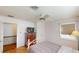 Bright bedroom with a comfortable bed, hardwood floors, and a closet, perfect for relaxation and rest at 671 Roanoke Rd, Venice, FL 34293