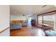 The living room features custom wood built-ins, hardwood flooring, and large windows at 671 Roanoke Rd, Venice, FL 34293