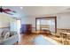 Spacious living room features hardwood floors, large bay window, and natural light at 671 Roanoke Rd, Venice, FL 34293