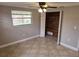 Bedroom with tile flooring and a closet with wood paneling at 7352 Sequoia Dr, New Port Richey, FL 34653