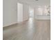Bright and open living area featuring light wood-look floors and ample natural light at 17982 Cherished Loop, Bradenton, FL 34211