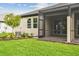 Inviting screened-in patio with views of the beautifully landscaped backyard and green lawn at 17982 Cherished Loop, Bradenton, FL 34211