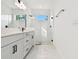 Modern bathroom with dual sink vanity, glass shower, and subway tile at 17986 Cherished Loop, Bradenton, FL 34211