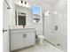 Modern bathroom with a glass shower, single sink vanity, and marble tile flooring at 17986 Cherished Loop, Bradenton, FL 34211