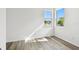 Well-lit bedroom with beautiful plank floors and sunlit windows, a relaxing retreat at 17986 Cherished Loop, Bradenton, FL 34211