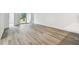 Bright living room features wood-look tile flooring and access to outdoor space at 17986 Cherished Loop, Bradenton, FL 34211