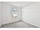 Bedroom with neutral carpet and a window providing a neighborhood view at 5421 Tripoli Dr, Palmetto, FL 34221