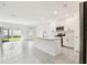 Modern kitchen with white cabinetry, stainless steel appliances, and a center island for extra counter space at 5421 Tripoli Dr, Palmetto, FL 34221