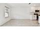 An open living area featuring an additional window and a seamless transition to the kitchen at 5421 Tripoli Dr, Palmetto, FL 34221