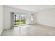 Bright living room with sliding glass door offering a view of the backyard at 5421 Tripoli Dr, Palmetto, FL 34221