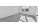 Bedroom with carpet, white walls, baseboards, a window, and a white door at 5425 Tripoli Dr, Palmetto, FL 34221