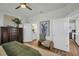 Comfortable bedroom showcasing a bathroom with a double sink vanity at 7959 Chandler Lake Ct, Hudson, FL 34667