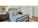 Cozy bedroom with comfortable furniture, ample natural light, and a view of the closet at 7959 Chandler Lake Ct, Hudson, FL 34667
