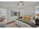 Bright bedroom showcasing an open doorway to a comfortably furnished living room at 7959 Chandler Lake Ct, Hudson, FL 34667