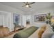 Spacious bedroom offering views of the dining room and featuring stylish decor at 7959 Chandler Lake Ct, Hudson, FL 34667