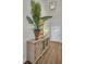 Entryway with laminate flooring, sideboard, and bright chandelier at 7959 Chandler Lake Ct, Hudson, FL 34667