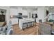 Modern open concept kitchen with center island and modern bar stools at 7959 Chandler Lake Ct, Hudson, FL 34667