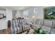Bright living room features comfortable seating, stylish decor, and an open floor plan at 7959 Chandler Lake Ct, Hudson, FL 34667