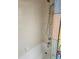 Bathroom features a shower/tub combination with white tiling and shower curtain at 8744 54Th W Ave # 8744, Bradenton, FL 34210