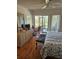 Bedroom featuring wood flooring, a king bed and outdoor patio overlooking the water at 8744 54Th W Ave # 8744, Bradenton, FL 34210