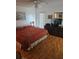 Comfortable bedroom featuring hardwood floors and a ceiling fan for added comfort at 8744 54Th W Ave # 8744, Bradenton, FL 34210