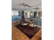 Charming dining room featuring hardwood floors, decorative rug, table setting and a mirrored wall at 8744 54Th W Ave # 8744, Bradenton, FL 34210