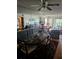 Inviting dining room with decorative rug, table setting, a mirrored wall reflecting living room and natural light at 8744 54Th W Ave # 8744, Bradenton, FL 34210