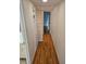 Hallway with hardwood floors connecting different areas of the home at 8744 54Th W Ave # 8744, Bradenton, FL 34210