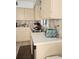 Well-lit kitchen with bright countertops, tile backsplash, and a view over the sink at 8744 54Th W Ave # 8744, Bradenton, FL 34210