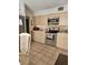 Bright kitchen featuring stainless steel appliances, tile backsplash, and ample counter space at 8744 54Th W Ave # 8744, Bradenton, FL 34210