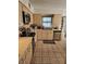 Updated kitchen with stainless steel appliances, tiled floors, and an open layout at 8744 54Th W Ave # 8744, Bradenton, FL 34210