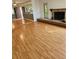 Open living room featuring hardwood floors, fireplace, and natural light from windows at 8744 54Th W Ave # 8744, Bradenton, FL 34210