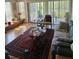 Bright living room with comfortable seating and sliding glass doors to a patio overlooking water at 8744 54Th W Ave # 8744, Bradenton, FL 34210
