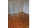 Living room with hardwood flooring, lots of natural light and access to a balcony at 8744 54Th W Ave # 8744, Bradenton, FL 34210