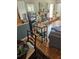 View of the living room with a fireplace, wooden floors and a wine and glass cart at 8744 54Th W Ave # 8744, Bradenton, FL 34210