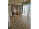 Enclosed patio with tile flooring and sliding glass doors, offering additional living space at 8744 54Th W Ave # 8744, Bradenton, FL 34210