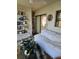 Comfortable patio with a bookshelf, plants, and daybed, extending indoor living to the outdoors at 8744 54Th W Ave # 8744, Bradenton, FL 34210