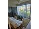 Cozy patio space with a daybed and view, perfect for relaxation and enjoying the outdoors at 8744 54Th W Ave # 8744, Bradenton, FL 34210