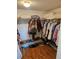 Walk-in closet with plentiful shelving, rods, handbags and shoes at 8744 54Th W Ave # 8744, Bradenton, FL 34210