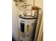 Water heater with visible plumbing and safety labels for maintenance and awareness at 8744 54Th W Ave # 8744, Bradenton, FL 34210