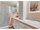 Bathroom featuring glass enclosed shower and white vanity with ample storage at 11820 Stone Pine St, Riverview, FL 33569