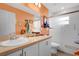 Well-lit bathroom with a vanity, large mirror, and glass-enclosed shower at 11820 Stone Pine St, Riverview, FL 33569