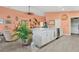 Bright open concept kitchen showcasing white cabinets, modern appliances, and seamless flow into the dining and living areas at 11820 Stone Pine St, Riverview, FL 33569