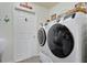 Bright laundry room with modern washer and dryer at 11820 Stone Pine St, Riverview, FL 33569