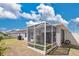 Enclosed screened patio with space for outdoor seating and relaxation, and well-maintained lawn at 11820 Stone Pine St, Riverview, FL 33569