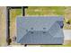 Aerial view of a home's gray shingle roof and fenced-in yard at 11820 Stone Pine St, Riverview, FL 33569