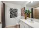 This bathroom features decorative accents, granite countertops, and a shower at 1755 Spreader Ln, Sarasota, FL 34240