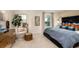 This bedroom is bright with a large bed, a sitting area, and decor at 1755 Spreader Ln, Sarasota, FL 34240